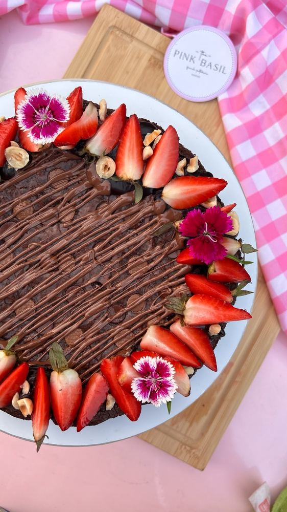 Strawberry and Nutella brownie cake with edible flowers