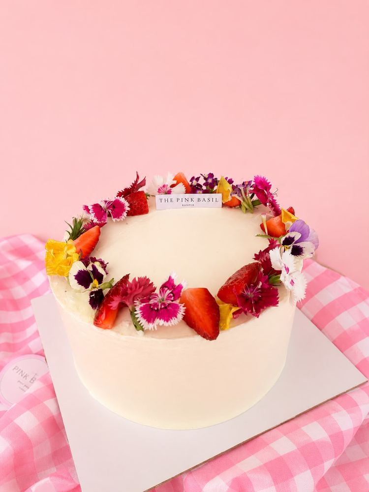 Two-tier celebration cake with pearls and white peonies